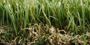 Close-up of artificial grass with green and brown strands