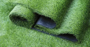 Rolled sections of artificial grass on a flat surface