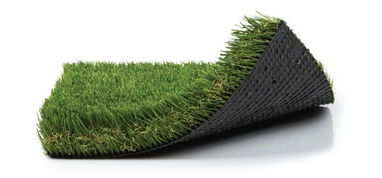 Section of artificial turf rolled partially onto a black backing