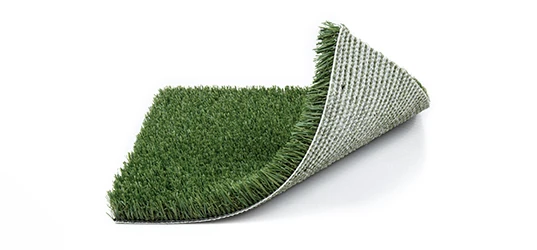 Rolled-up section of artificial grass on a white background